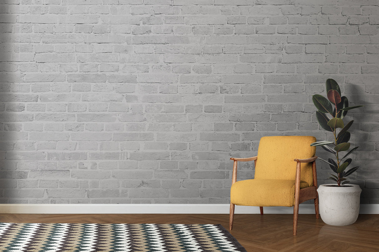 Textured white brick wall mural in home office with minimal furniture