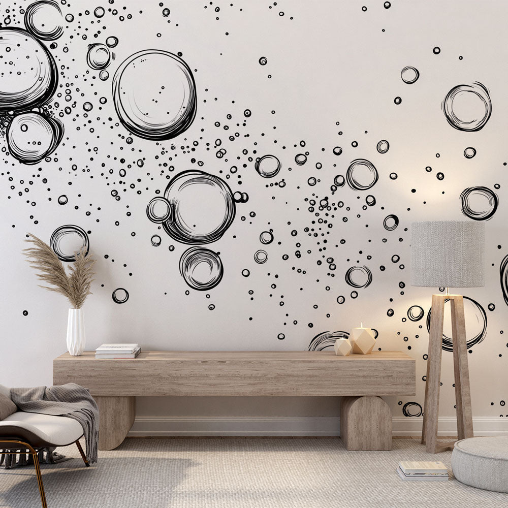 Modern bubble wallpaper creating depth in a minimalist living room with white sofa and black accents