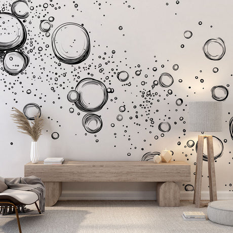 Modern bubble wallpaper creating depth in a minimalist living room with white sofa and black accents