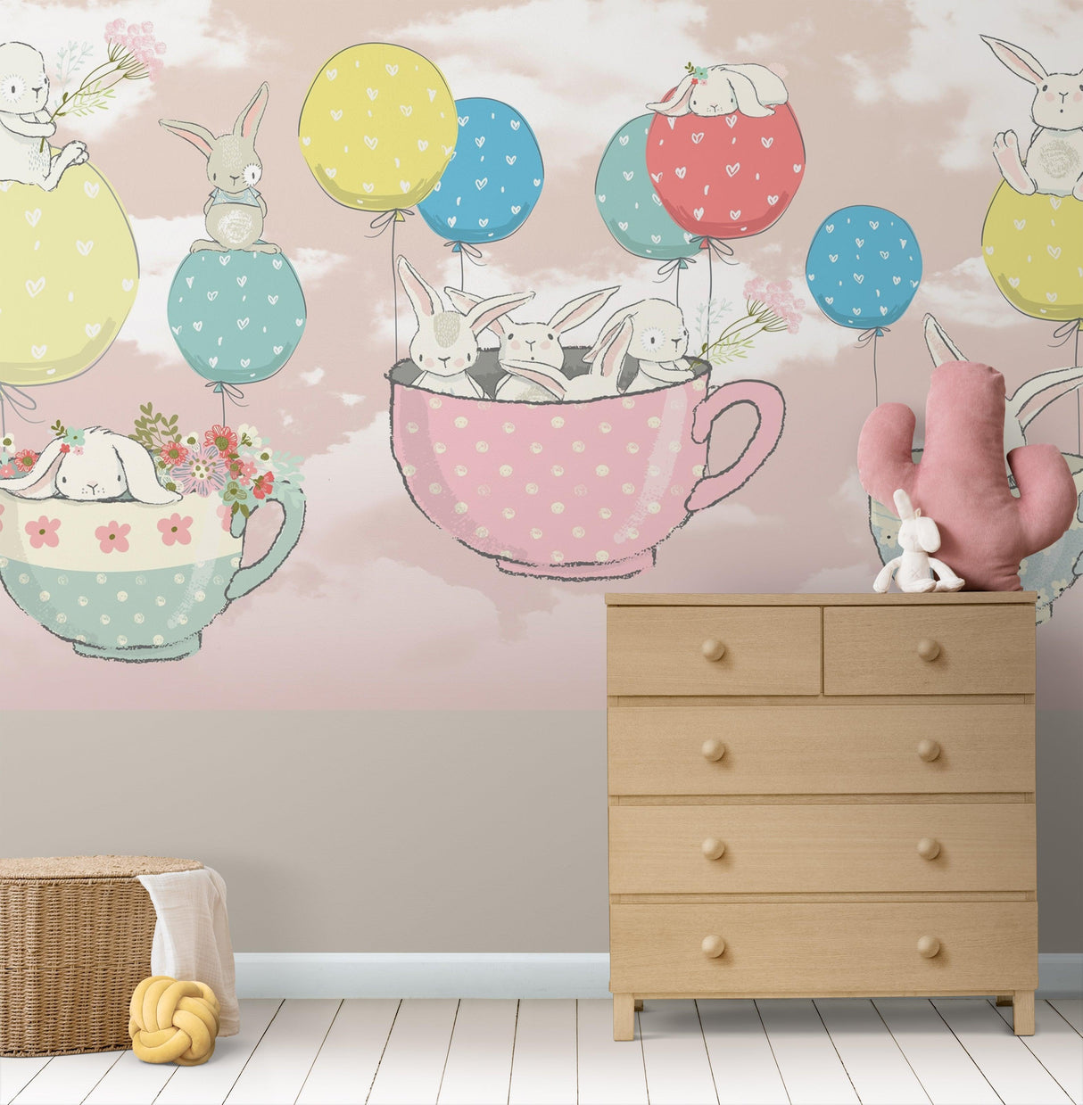 Bunny nursery wallpaper in a bright children's bedroom with white furniture and pastel accessories