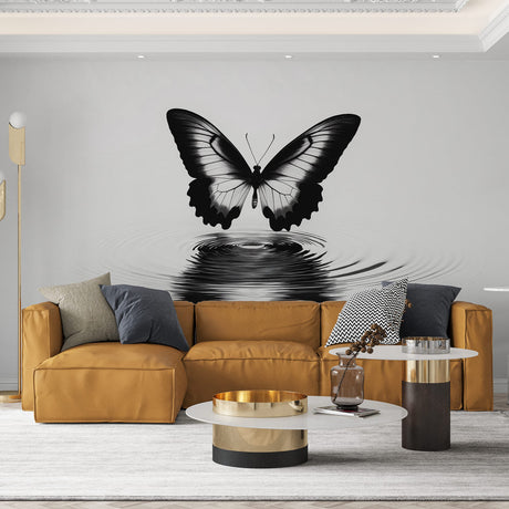 Black and white butterfly wallpaper creating drama in a modern living room with minimalist furniture