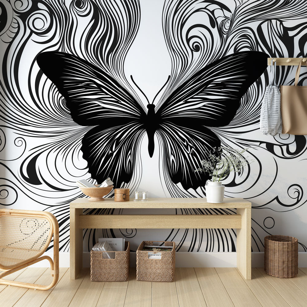 Black and white butterfly wallpaper mural creating dramatic impact in modern living room with minimal furniture