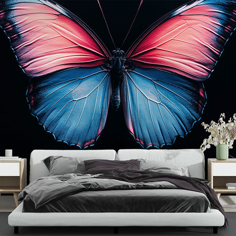 Butterfly wall mural with blue and pink wings creating drama in a modern living room with grey sofa and natural light