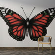 Red Monarch Butterfly Wallpaper displayed in bright modern living room, showing dramatic wing detail and scale