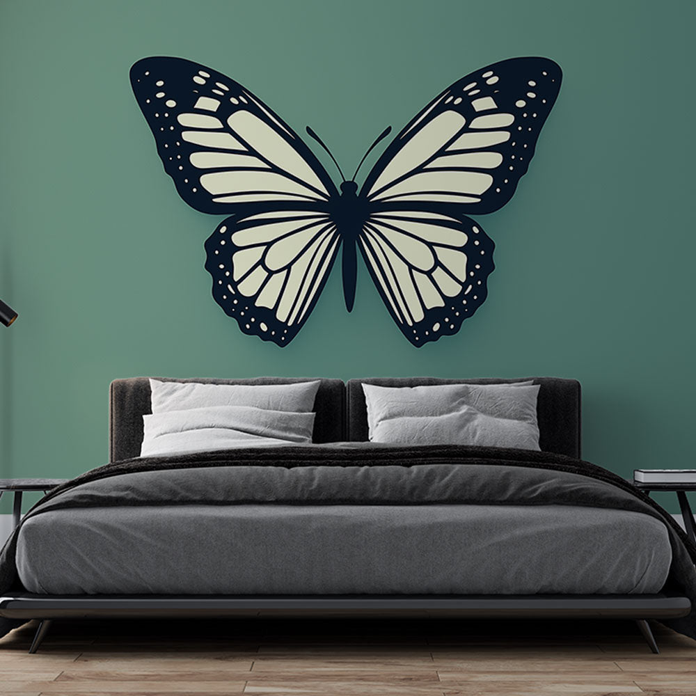 Black and white butterfly wall mural creating modern contrast in a bright living room with minimal furniture