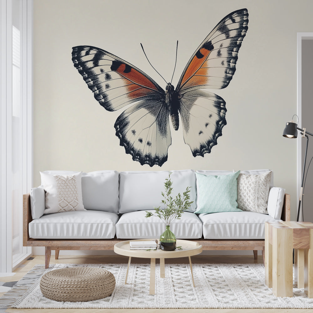 Butterfly wall mural with orange wings creating a stunning focal point in a modern living room with natural lighting