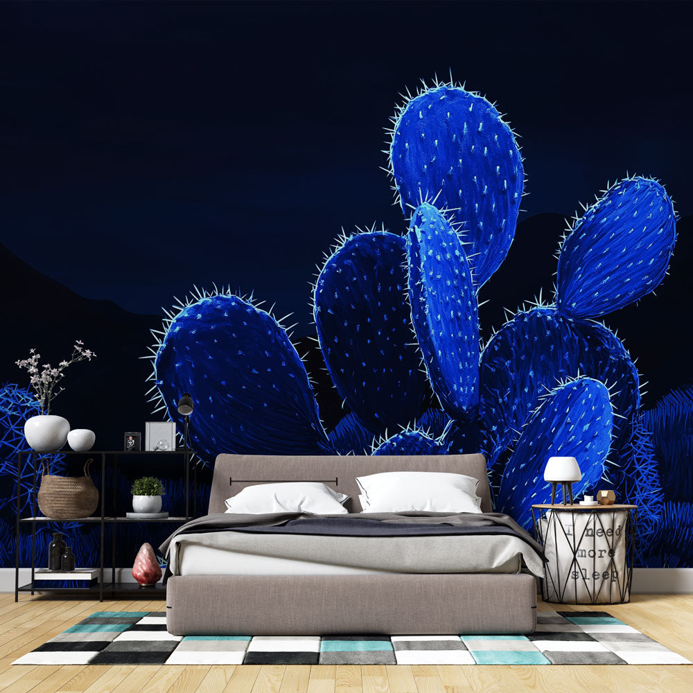 Blue glowing cactus wallpaper creating a magical atmosphere in a modern living room with minimalist furniture