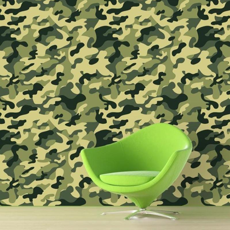Army camouflage wallpaper creating a bold accent wall in a modern home office