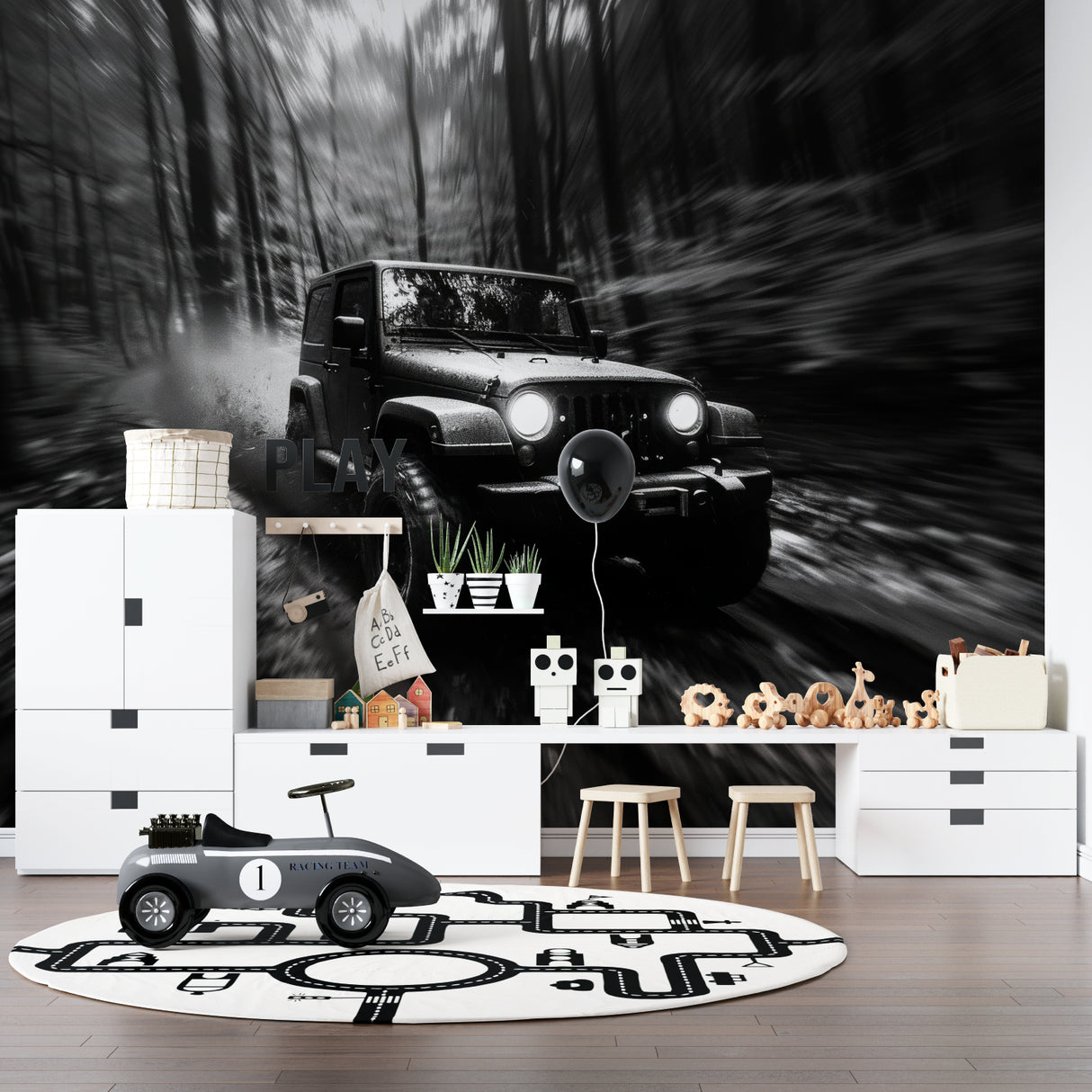 Black and white car wallpaper creating drama in modern living room with grey sofa and minimal decor