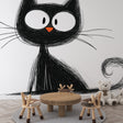 Black and white cat mural wallpaper bringing character to a modern living room with minimalist furniture