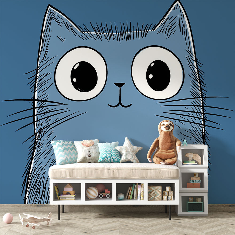 Cartoon blue cat wallpaper with big eyes creates a playful atmosphere in a modern nursery with white furniture