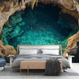 Cave lake wallpaper bringing depth to a modern living room, emerald waters reflecting on white furniture