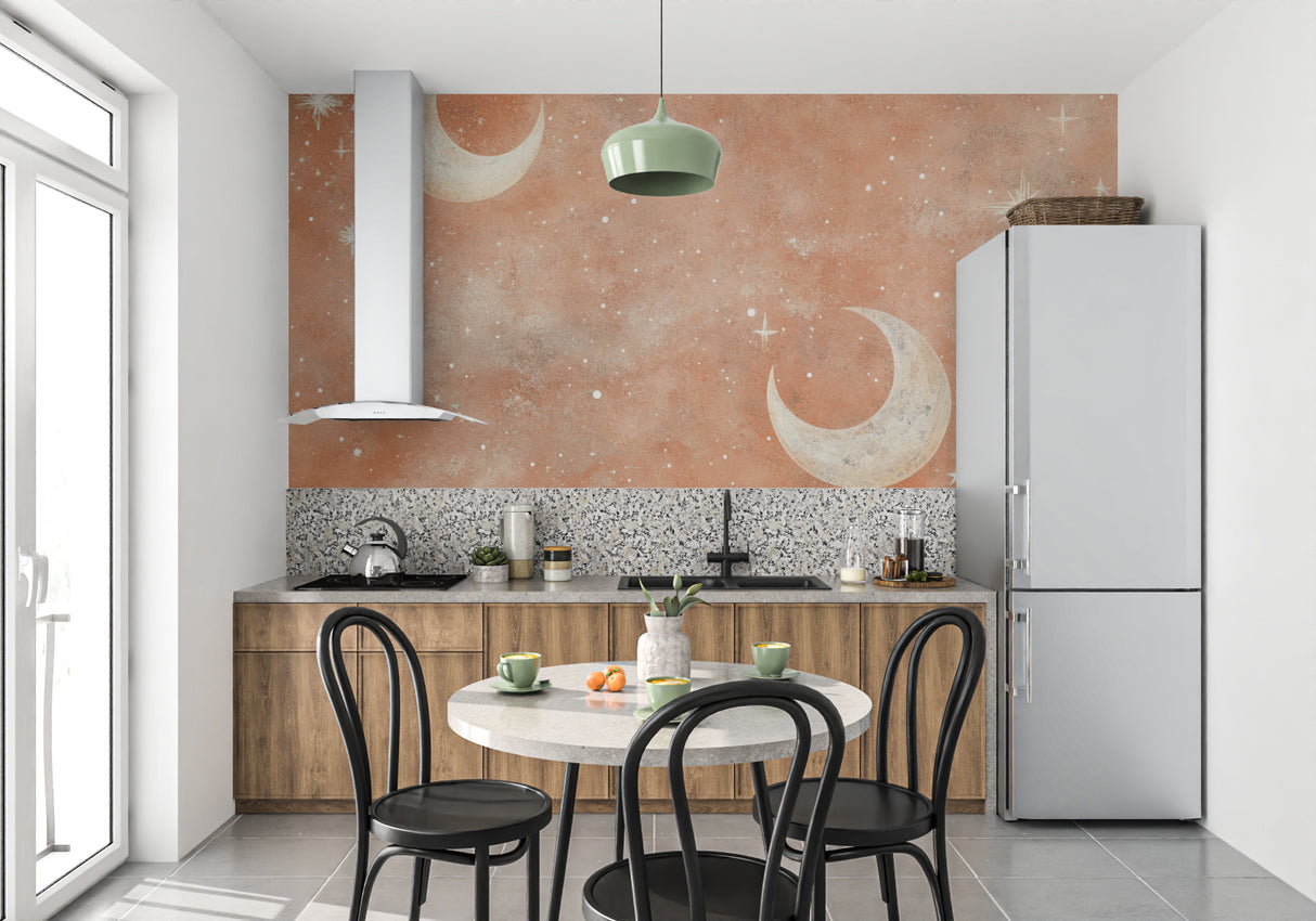 Moon and stars mural in nursery with gentle terracotta tones