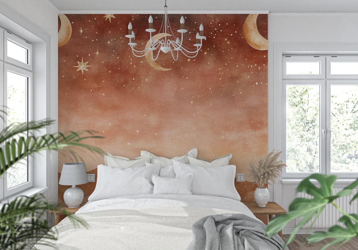 Terracotta moon wallpaper adding warmth to a nursery with soft lighting