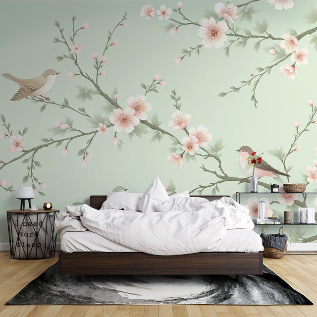 Cherry blossom wallpaper with birds creating a peaceful atmosphere in a modern bedroom with natural light