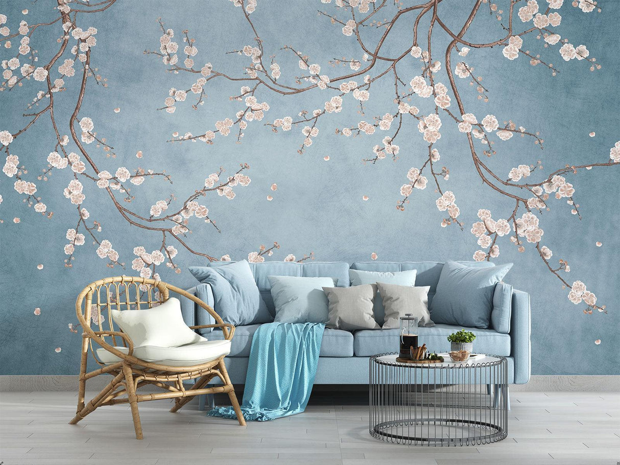 Cherry blossom wallpaper creating a peaceful atmosphere in a modern living room with blue and pink tones