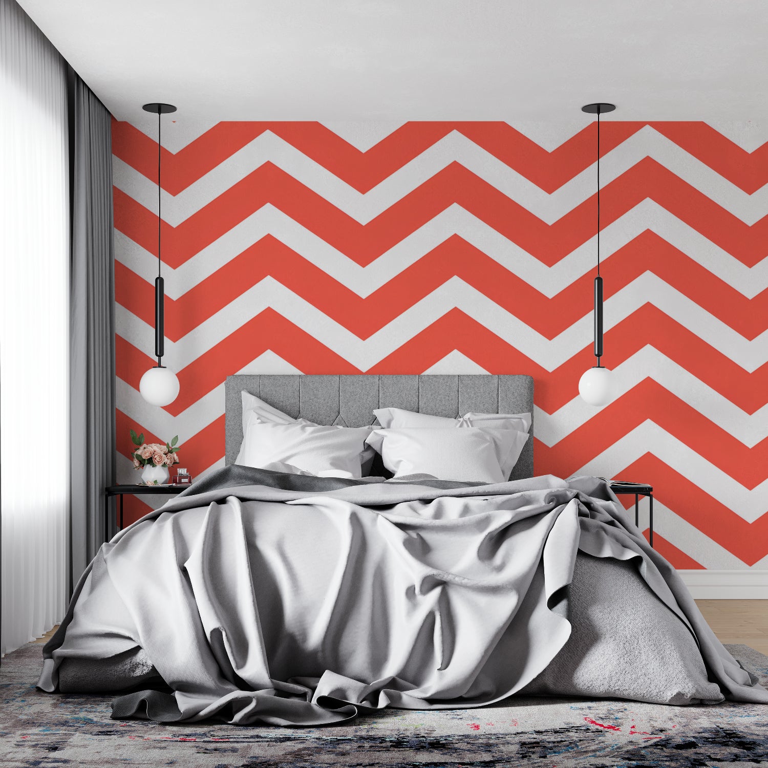 Red and white geometric wallpaper adding energy to a bedroom accent wall