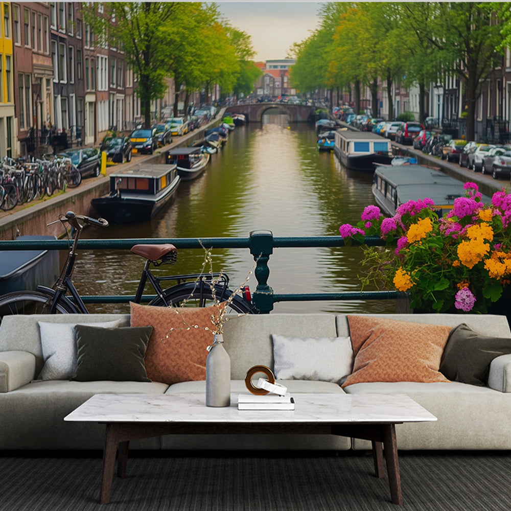 Amsterdam canal mural wallpaper creating depth in a bright modern living room with white furniture and natural light