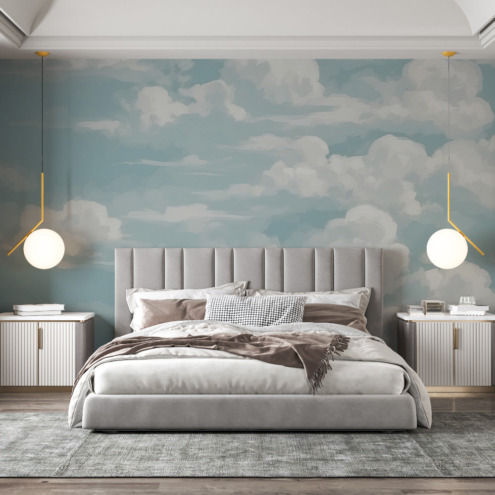 Cloud mural wallpaper creating a bright, open atmosphere in a modern living room with white furniture