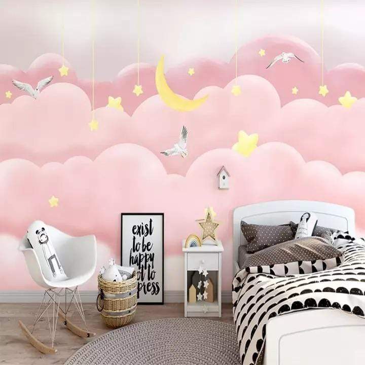 Dreamy pink sky mural with clouds and stars brightening a children's bedroom