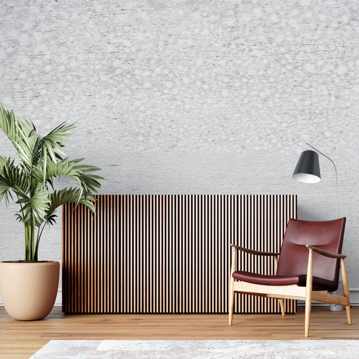Modern concrete effect wallpaper in a minimalist living room with grey sofa and natural light