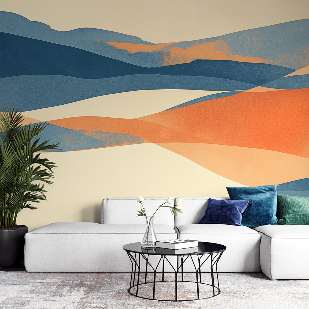Modern desert mural wallpaper shown in a minimalist living room, orange and blue abstract dunes creating a calm atmosphere