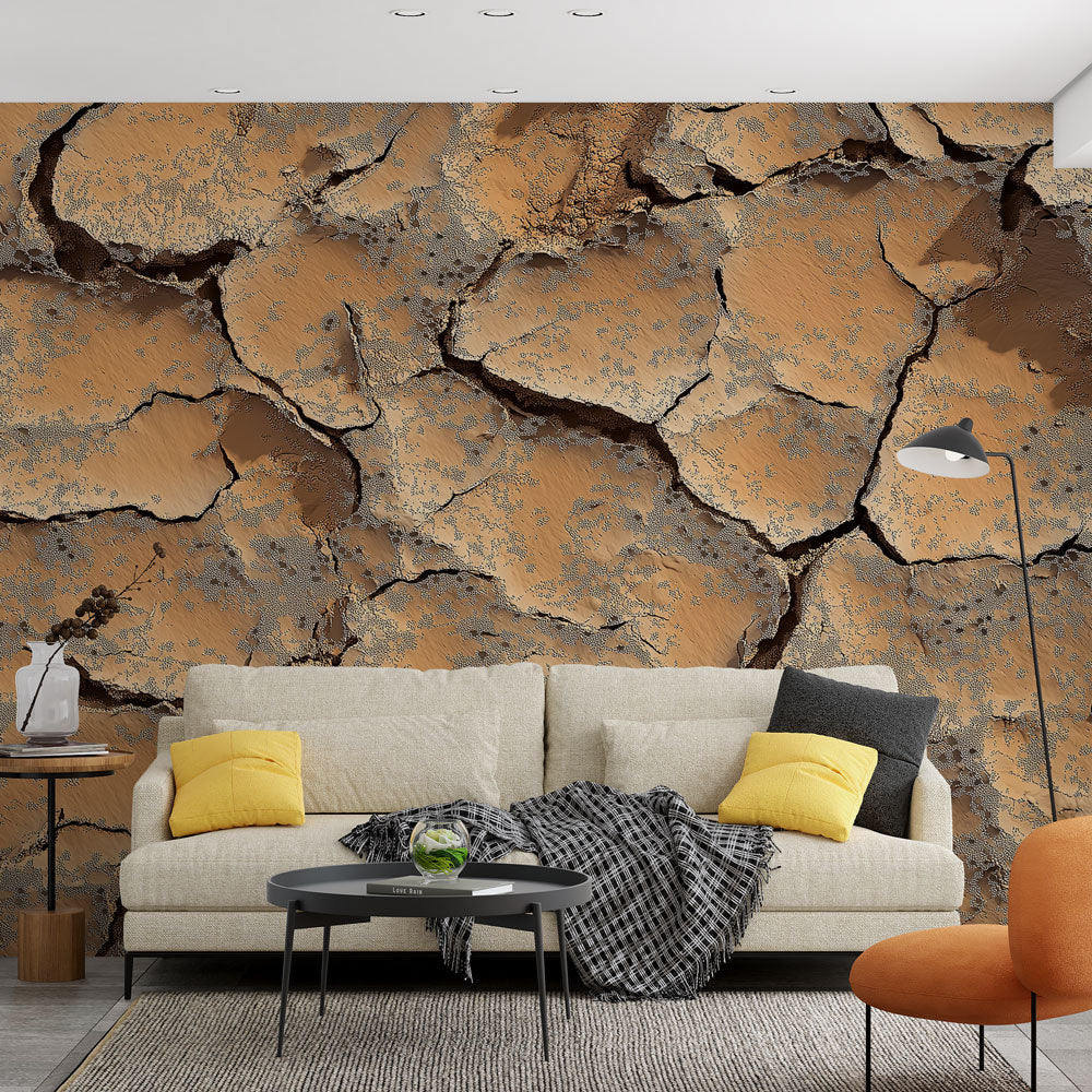 Desert landscape wallpaper with cracked earth pattern creating depth in a modern living room with earth-toned furniture