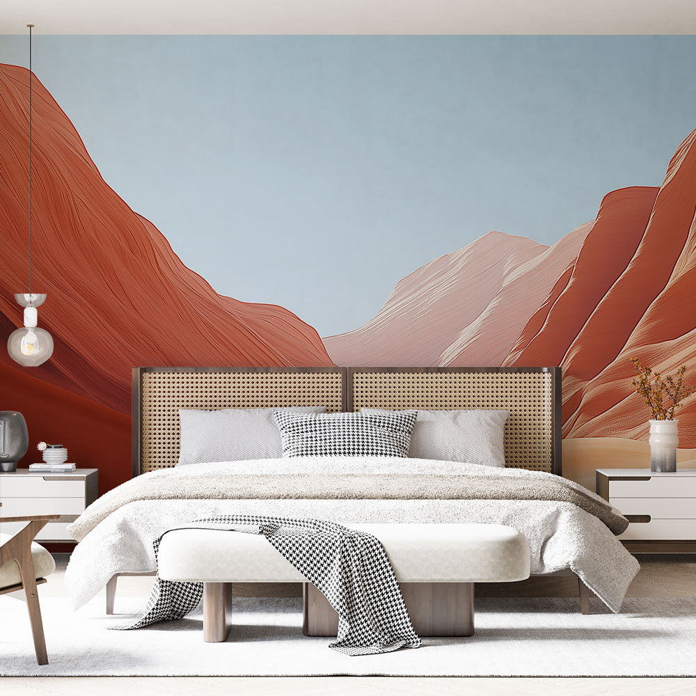 Desert landscape wallpaper bringing warm terracotta tones to a modern living room with minimal furniture