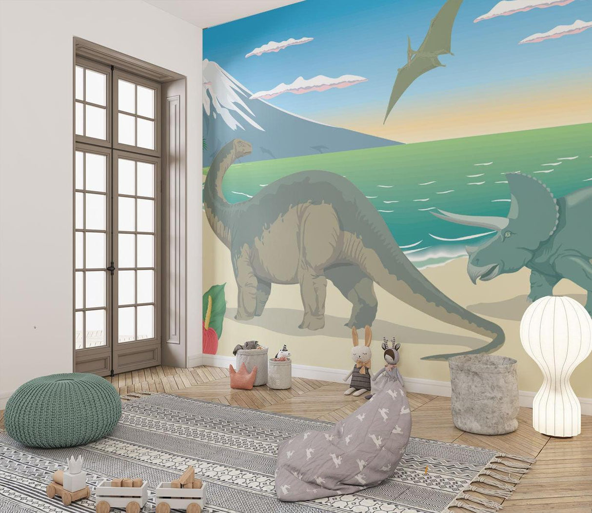 Nursery featuring dinosaur wall mural with gentle beach colors and mountains