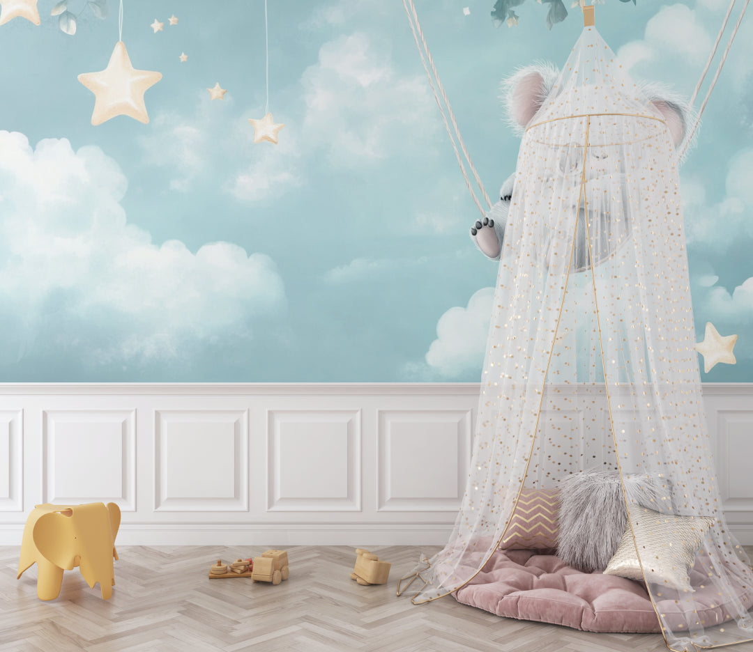Koala nursery wallpaper creating a magical atmosphere in a modern nursery with white furniture