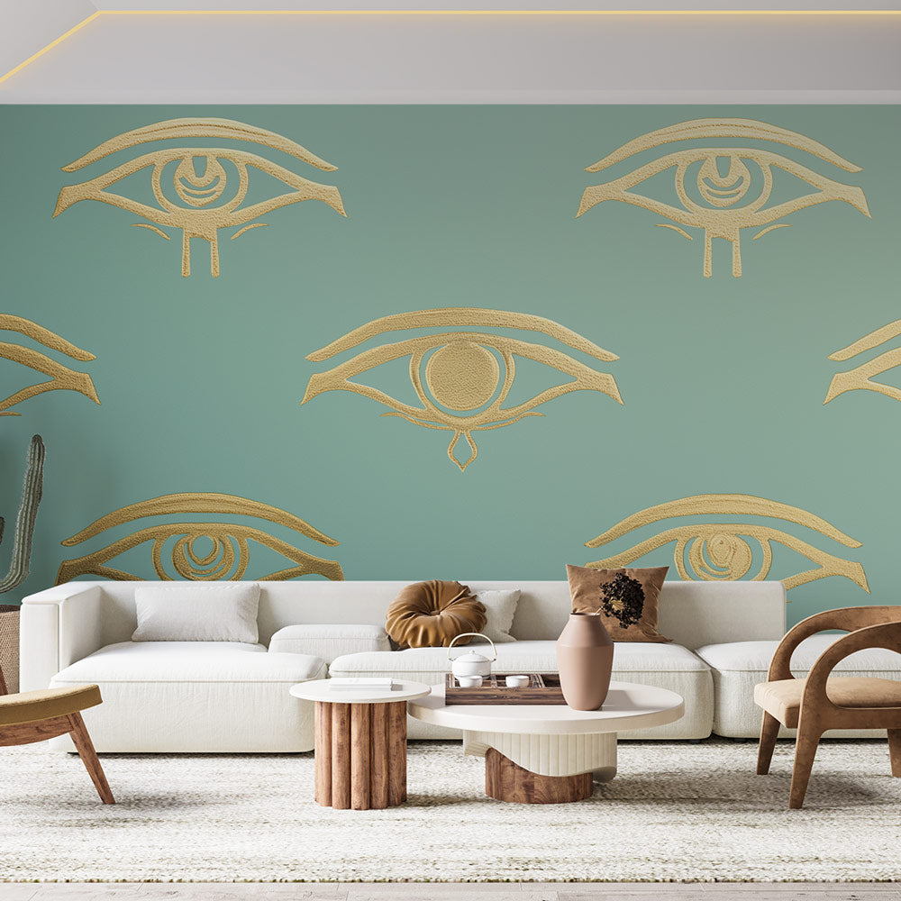 Egyptian Eye of Horus wallpaper creating a stunning gold accent wall in a modern living room with minimal furniture
