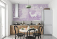 Purple castle forest wallpaper in cozy nursery with white furniture showing magical atmosphere