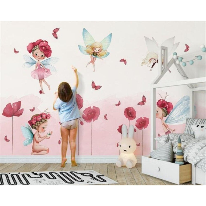 Fairy garden wallpaper mural creating a magical atmosphere in a girl's bedroom with soft pink poppies and dancing fairies