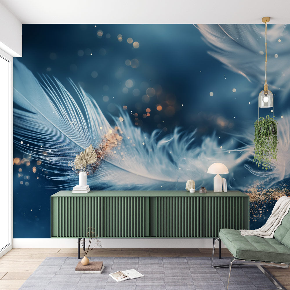 Blue and gold feather wallpaper mural in modern bedroom with natural lighting showing floating feather pattern