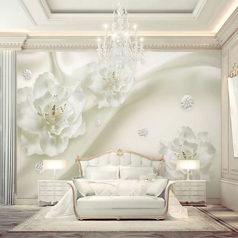 3D white floral mural wallpaper brightening a dining room with soft, dimensional blooms
