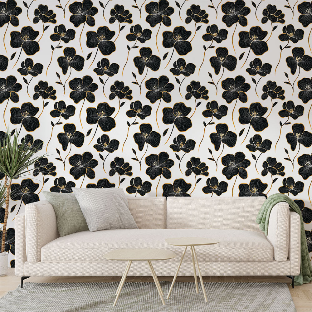 Black and gold floral wallpaper creating elegant atmosphere in modern living room with high ceilings