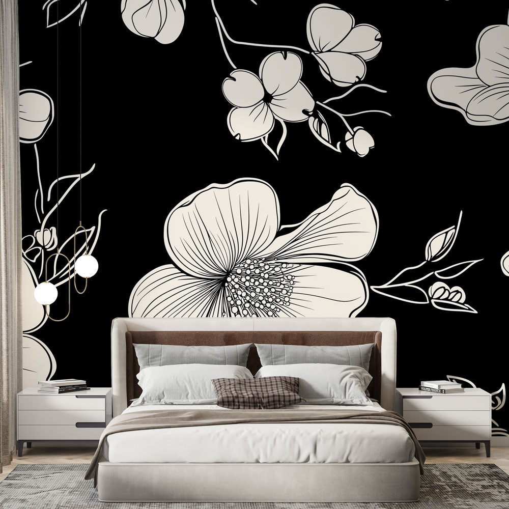 Black and white floral wallpaper creating a stunning focal point in a modern living room with minimalist furniture