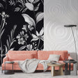 Black and white floral wallpaper creating drama in modern living room with mid-century furniture