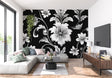 Black and white floral wallpaper in modern living room setting with minimal furniture
