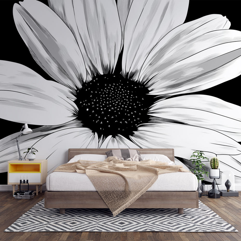 Black and white daisy wallpaper in modern living room showing dramatic floral close-up pattern against white walls