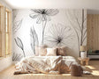 Black and white floral line art wallpaper creating a stunning focal point in a modern living room with minimal furniture
