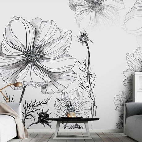 Black and white floral line art wallpaper in modern living room with minimal furniture