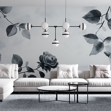 Black and white rose mural wallpaper creating an elegant atmosphere in a modern dining room with minimalist furniture