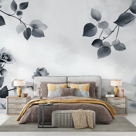 Black and white rose wallpaper mural creating drama in a modern living room with minimal furniture