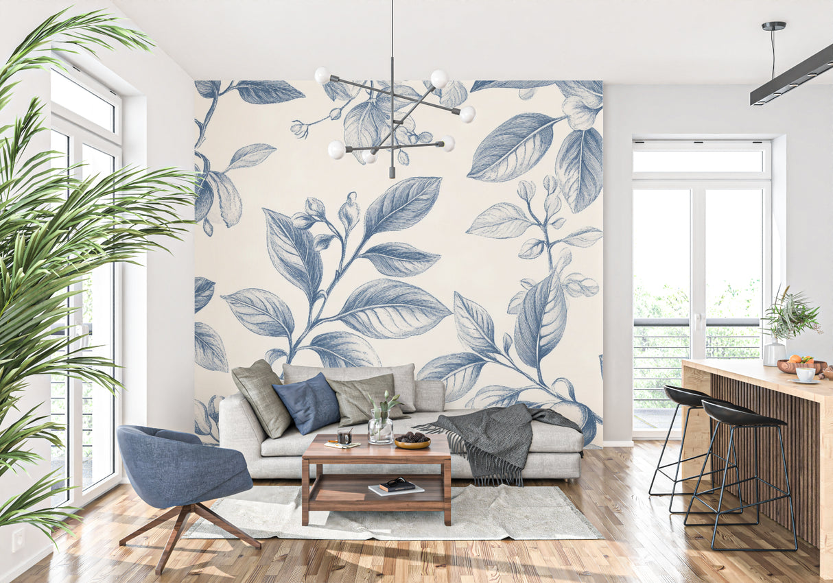 Reading nook with blue floral wallpaper and comfortable armchair