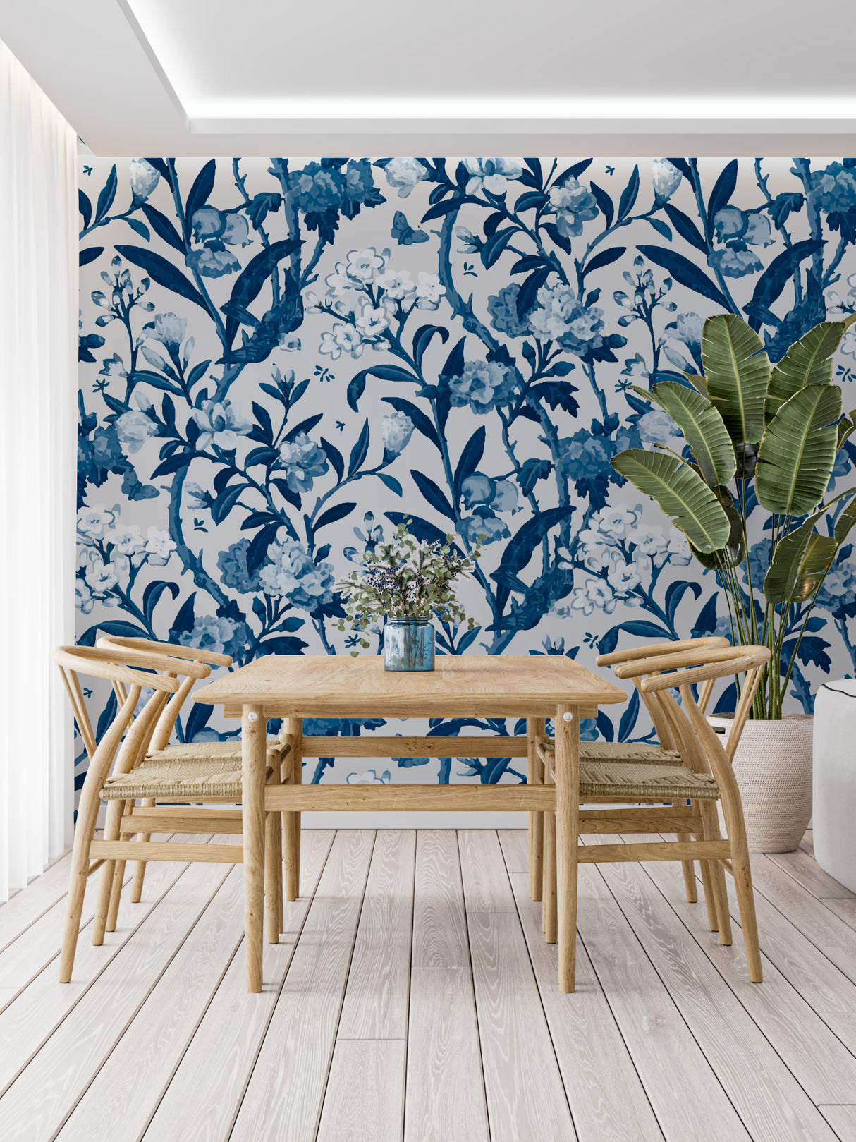 Dining room featuring blue botanical wallpaper, adding sophistication to the entertaining space
