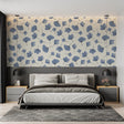 Blue leaf pattern wallpaper in a bright modern living room creating a calm atmosphere