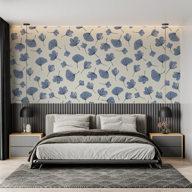 Blue leaf pattern wallpaper in a bright modern living room creating a calm atmosphere