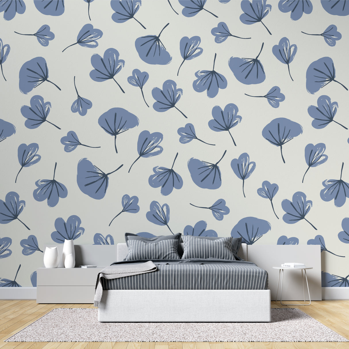 Floral wall mural with blue leaves in a cozy bedroom setting