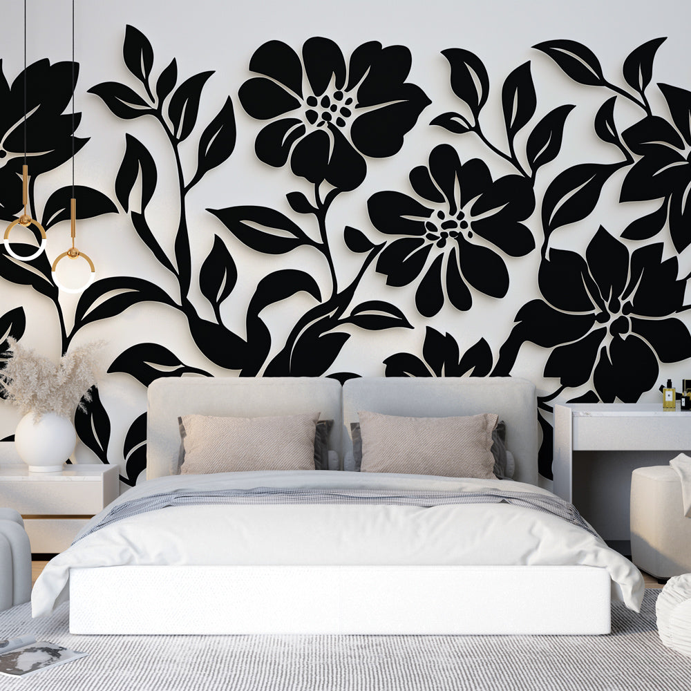 Black and white floral wallpaper mural creating drama in a modern living room with minimalist furniture